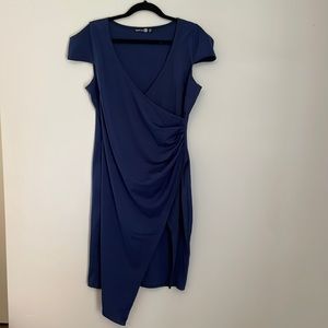 Dress with ruched side and slit up slide.